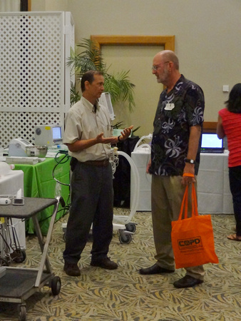 Hawaii State Respiratory Conference, September 2013.  The Director of Castle Medical Center’s Cardiopulmonary Department speaks with Eric Tessmer.  Lifescience Resources photo by John McMahon.