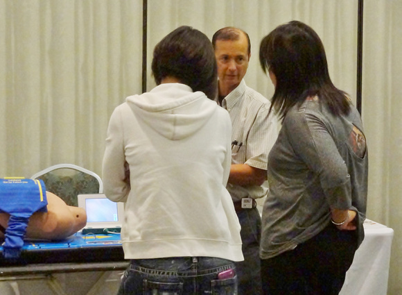 Hawaii State Respiratory Conference, September 2013.  Eric Tessmer reviewing the King Vision with Kapiolani Community College students.  Lifescience Resources photo by John McMahon.